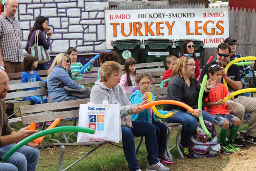 Participants egear to learn how to make a balloon dog