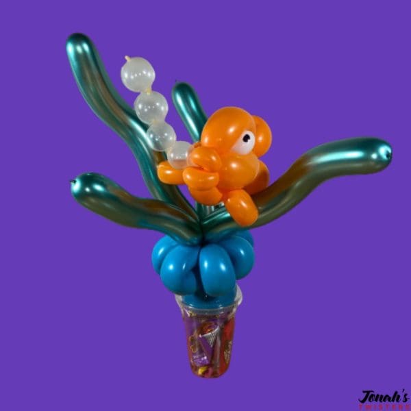 a fish swimming made out of balloons