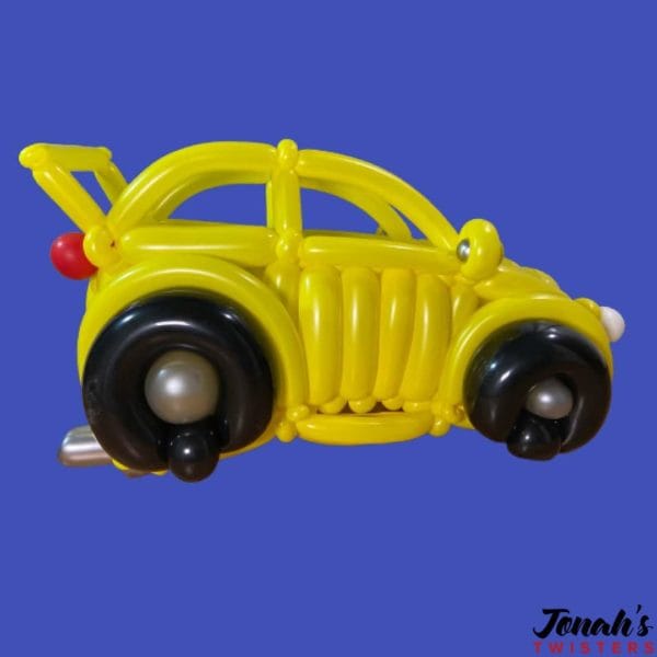 A yellow car made out of balloons