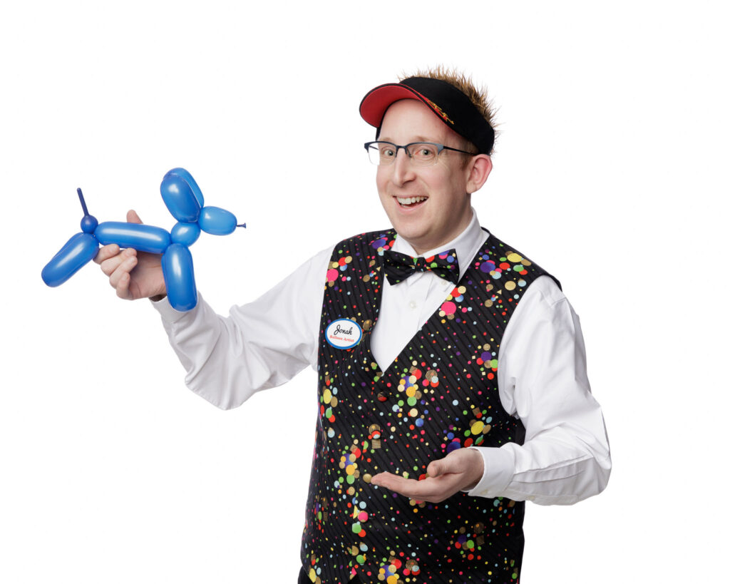 Jonah holding a balloon dog